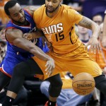 Philadelphia 76ers' Luc Mbah a Moute, left, strips the ball from Phoenix Suns' Marcus Morris (15) during the first half of an NBA basketball game Friday, Jan. 2, 2015, in Phoenix. (AP Photo/Ross D. Franklin)
