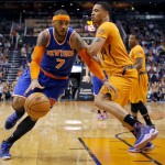 New York Knicks' Carmelo Anthony (7) drives agasint Phoenix Suns' Gerald Green during the first half of an NBA basketball game, Friday, March 28, 2014, in Phoenix. (AP Photo/Matt York)