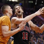 Chicago Bulls' Pau Gasol (16), of Spain, shouts as he looks for a shot against Phoenix Suns' Alex Len during the first half of an NBA basketball game Friday, Jan. 30, 2015, in Phoenix. (AP Photo/Ross D. Franklin)
