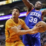 Phoenix Suns' Gerald Green, left, drives past Philadelphia 76ers' Jerami Grant (39) to score during the second half of an NBA basketball game Friday, Jan. 2, 2015, in Phoenix. The Suns defeated the 76ers 112-96. (AP Photo/Ross D. Franklin)
