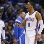 Oklahoma City Thunder guard Russell Westbrook (0) shouts after hitting a basket and being awarded a foul shot in the first quarter of an NBA basketball game against the Phoenix Suns in Oklahoma City, Sunday, Dec. 14, 2014. Oklahoma City won 112-88. (AP Photo/Sue Ogrocki)