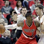 Portland Trail Blazers guard Wesley Matthews, left, works the ball in against Phoenix Suns guard Goran Dragic, from Slovenia, during the first half of an NBA basketball game in Portland, Ore., Thursday, Feb. 5, 2015. (AP Photo/Don Ryan)