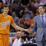 Phoenix Suns' Goran Dragic (1), of Slovenia, gives five to coach Jeff Hornacek during the second half of an NBA basketball game against the New York Knicks, Friday, March 28, 2014, in Phoenix. The Suns won 112-88. (AP Photo/Matt York)