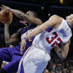 Phoenix Suns' Eric Bledsoe, left, fouls Los Angeles Clippers' Blake Griffin during the second half of an NBA basketball game Monday, Dec. 8, 2014, in Los Angeles. The Clippers won 121-120 in overtime. (AP Photo/Jae C. Hong)