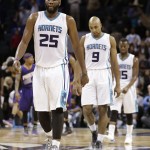 Charlotte Hornets' Al Jefferson (25), Gerald Henderson (9), and Kemba Walker (15) walk off the court after the Hornets lost an NBA basketball game against the Phoenix Suns in Charlotte, N.C., Wednesday, Dec. 17, 2014. The Suns won 111-106. (AP Photo/Chuck Burton)