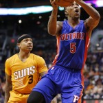 Detroit Pistons' Kentavious Caldwell-Pope (5) drives past Phoenix Suns' Isaiah Thomas (3) during the first half of an NBA basketball game Friday, Dec. 12, 2014, in Phoenix. (AP Photo/Ross D. Franklin)