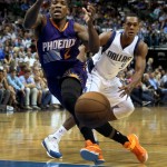 Phoenix Suns guard Eric Bledsoe (2) looses the ball after Dallas Mavericks Rajon Rondo (9) stripped the ball in the first half of the NBA basketball game in Dallas on Wednesday, April 8, 2015. (AP Photo/Brad Loper)