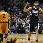 Sacramento Kings forward Omri Casspi (18) celebrates as time expires during the second half of an NBA basketball game against the Phoenix Suns, Friday, Nov. 7, 2014, in Phoenix. The Kings won 114-112 in double overtime. (AP Photo/Matt York)