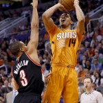 Phoenix Suns' Gerald Green (14) shoots over Portland Trail Blazers' C.J. McCollum (3) during the second half of an NBA basketball game, Friday, March 27, 2015, in Phoenix. The Trail Blazers won 87-81. (AP Photo/Matt York)