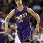 Phoenix Suns' Gerald Green reacts after making a 3-point basket against the Charlotte Hornets during the first half of an NBA basketball game in Charlotte, N.C., Wednesday, Dec. 17, 2014. (AP Photo/Chuck Burton)