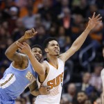 Denver Nuggets' Alonzo Gee, left, strips the ball from Phoenix Suns' Gerald Green during the first half of an NBA basketball game Wednesday, Nov. 26, 2014, in Phoenix. The Suns defeated the Nuggets 120-112. (AP Photo/Ross D. Franklin)