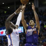 Phoenix Suns guard Gerald Green (14) shoots over Oklahoma City Thunder guard Reggie Jackson, left, in the second quarter of an NBA basketball game in Oklahoma City, Sunday, Dec. 14, 2014. Oklahoma City won 112-88. (AP Photo/Sue Ogrocki)