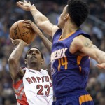 Toronto Raptors' Lou Williams, left, shoots in front of Phoenix Suns' Gerald Green during the first half of an NBA basketball game in Toronto on Monday, Nov. 24, 2014. (AP Photo/The Canadian Press, Darren Calabrese)
