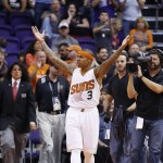 Phoenix Suns' Isaiah Thomas celebrates after scoring a basket against the Brooklyn Nets during the second half of an NBA basketball game Wednesday, Nov. 12, 2014, in Phoenix. The Suns defeated the Nets 112-104. (AP Photo/Ross D. Franklin)