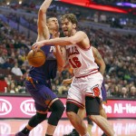 Chicago Bulls forward Pau Gasol (16)gets past Phoenix Suns center Alex Len (21) during the first half of an NBA basketball game in Chicago, on Saturday, Feb. 21, 2015. (AP Photo/Jeff Haynes)