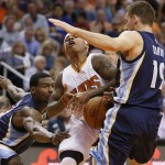 Phoenix Suns guard Isaiah Thomas (3) is fouled by Memphis Grizzlies guard Beno Udrih (19), of Slovenia, during the second half of an NBA basketball game, Wednesday, Nov. 5, 2014, in Phoenix. The Grizzlies won 102-91. (AP Photo/Matt York)