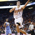 Phoenix Suns' Goran Dragic (1) gets past Denver Nuggets' Arron Afflalo, left, to score during the second half of an NBA basketball game Wednesday, Nov. 26, 2014, in Phoenix. The Suns defeated the Nuggets 120-112. (AP Photo/Ross D. Franklin)