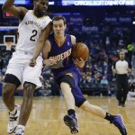 Phoenix Suns guard Goran Dragic (1) gets around New Orleans Pelicans forward Darius Miller (2) in the first half of an NBA basketball game in New Orleans, Wednesday, April 9, 2014. (AP Photo/Bill Haber)