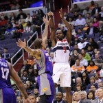Washington Wizards forward Martell Webster (9) shoots over Phoenix Suns forward Michael Beasley (0) during the second half of an NBA basketball game on Saturday, March 16, 2013, in Washington. The Wizards won 127-105. (AP Photo/Nick Wass)
