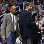Injured Los Angeles Lakers' Kobe Bryant, second from left, and Pau Gasol, of Spain, second from right, were in street clothes as they joined their teammates on the bench in the second half of an NBA basketball game against the Phoenix Suns on Monday, March 18, 2013, in Phoenix. Lakers' Dwight Howard (12) and Robert Sacre, right, flank their injured teammates in a 99-76 loss. (AP Photo/Ross D. Franklin)