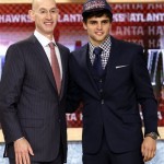 NBA Deputy Commissioner Adam Silver, left, poses with Raul Neto, of Brazil, who was selected by the Atlanta Hawks in the second round of the NBA basketball draft, Thursday, June 27, 2013, in New York. (AP Photo/Kathy Willens)