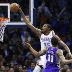 Oklahoma City Thunder forward Kevin Durant (35) goes up for a dunk in front of Phoenix Suns forward Markeiff Morris (11) in the second quarter of an NBA basketball game in Oklahoma City, Friday, Feb. 8, 2013. (AP Photo/Sue Ogrocki)