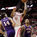 Houston Rockets guard James Harden (13) is fouled by Phoenix Suns forward Luis Scola (14) as he drives to the basket for a layup, while Suns guard P.J. Tucker (17) watches during the second half of an NBA basketball game Tuesday, April 9, 2013, in Houston. Houston won 101-98. (AP Photo/Bob Levey)