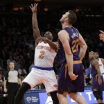 New York Knicks' Raymond Felton (2) shoots over Phoenix Suns' Miles Plumlee (22) during the first half of an NBA basketball game, Monday, Jan. 13, 2014, in New York. (AP Photo/Frank Franklin II)