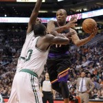 Phoenix Suns forward P.J. Tucker, right, is fouled by Boston Celtics forward Brandon Bass, front, as Tucker attempts to drive between Celtics forward Jeff Green, rear, and Bass in the second half of an NBA basketball game, Friday, Feb. 22, 2013, in Phoenix. (AP Photo/Paul Connors)