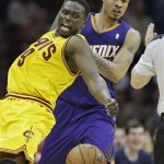 Cleveland Cavaliers' Luol Deng (9), from Sudan, is fouled by Phoenix Suns' Gerald Green in the fourth quarter of an NBA basketball game, Sunday, Jan. 26, 2014, in Cleveland. Phoenix won 99-90. (AP Photo/Mark Duncan)