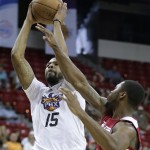 Phoenix Suns' Marcus Morris shoots against Miami Heat's Travis Leslie in the first quarter of an NBA Summer League basketball game on Sunday, July 21, 2013, in Las Vegas. (AP Photo/Julie Jacobson)