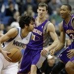 Minnesota Timberwolves' Ricky Rubio, left, of Spain, drives around Phoenix Suns' Goran Dragic, center, of Slovenia and Wesley Johnson in the second half of an NBA basketball game on Saturday, April 13, 2013, in Minneapolis. Rubio led the Timberwolves with 24 points and 10 assists in the Timberwolves' 105-93 win. Dragic had 14 assists for the Suns while Johnson scored 15. (AP Photo/Jim Mone)