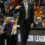 Phoenix Suns head coach Jeff Hornacek signals in a play in the first quarter during an NBA basketball game against the Houston Rockets, Sunday, Feb. 23, 2014, in Phoenix. (AP Photo/Rick Scuteri)
