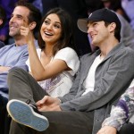 Actress Mila Kunis, left, and Ashton Kutcher, right sit courtside together at the NBA basketball game between the Phoenix Suns and Los Angeles Lakers on Tuesday, Feb. 12, 2013, in Los Angeles. (AP Photo/Danny Moloshok)