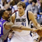 Dallas Mavericks' Dirk Nowitzki (41), of Germany, fights Phoenix Suns' Markieff Morris (11) for an opening to the basket in the first half of an NBA basketball game, Sunday, Jan. 27, 2013, in Dallas. (AP Photo/Tony Gutierrez)