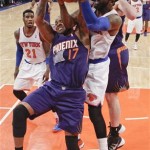 New York Knicks' Amar'e Stoudemire (1) and Phoenix Suns' P.J. Tucker (17) fight for control of the ball during the second half of an NBA basketball game, Monday, Jan. 13, 2014, in New York. The Knicks won the game 98-96. (AP Photo/Frank Franklin II)