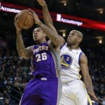 Phoenix Suns' Shannon Brown (26) goes up for a shot against Golden State Warriors' Jarret Jack (2) in the first half of an NBA basketball game Saturday, Feb. 2, 2013, in Oakland, Calif. (AP Photo/Ben Margot)
