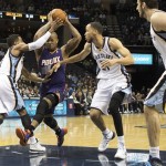 Phoenix Suns forward P.J. Tucker, second from left, goes to the basket against Memphis Grizzlies guard Mike Conley (11), forward Tayshaun Prince (21) and center Kosta Koufos (41) in the first half of an NBA basketball game, Friday, Jan. 10, 2014, in Memphis, Tenn. (AP Photo/Lance Murphey)