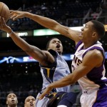 Memphis Grizzlies' Rudy Gay has his shot blocked by Phoenix Suns' Wesley Johnson, right, during the first half of an NBA basketball game, Sunday, Jan. 6, 2013, in Phoenix. (AP Photo/Matt York)
