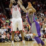 Houston Rockets guard James Harden (13) shoots a 3-pointer at the end of the NBA basketball game, as Phoenix Suns guard P.J. Tucker (17) defends on Tuesday, April 9, 2013, in Houston. Suns center Jermaine O'Neal was called for goaltending on the play, giving Houston a 101-98 victory. (AP Photo/Bob Levey)