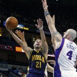 New Orleans Hornets point guard Greivis Vasquez (21) drives to the basket around Phoenix Suns center Marcin Gortat (4) in the second half of an NBA basketball game in New Orleans, Wednesday, Feb. 6, 2013. The Hornets defeated the Suns 93-84. (AP Photo/Bill Haber)
