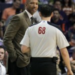 New Orleans Pelicans head coach Monty Williams, left, talks to NBA Official Marat Kogut in the first quarter during an NBA basketball game against the Phoenix Suns on Sunday, Nov. 10, 2013, in Phoenix. (AP Photo/Rick Scuteri)