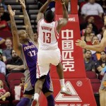 Houston Rockets guard James Harden (13) shoots over Phoenix Suns guard P.J. Tucker (17) during the first half of an NBA basketball game Tuesday, April 9, 2013, in Houston. (AP Photo/Bob Levey)