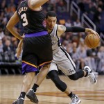 San Antonio Spurs' Danny Green collides with Phoenix Suns' Jared Dudley (3) during the first half of an NBA basketball game, Sunday, Feb. 24, 2013, in Phoenix. (AP Photo/Matt York)