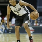 Portland Trail Blazers' C.J. McCollum sets the offense against the Phoenix Suns in the second quarter of an NBA Summer League basketball game onSaturday, July 13, 2013, in Las Vegas. (AP Photo/Julie Jacobson)
