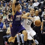  Minnesota Timberwolves' Kevin Martin, right, drives around Phoenix Suns' Gerald Green in the first quarter of an NBA basketball game on Wednesday, Jan. 8, 2014, in Minneapolis. (AP Photo/Jim Mone)