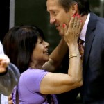 Jeff Hornacek, right, gets a warm greeting from JoAnn Fitzsimmons, wife of the late Phoenix Suns head coach and executive Cotton Fitzsimmons, prior to Hornacek being introduced as the Suns' new head coach during an NBA basketball news conference Tuesday, May 28, 2013, in Phoenix. (AP Photo/Ross D. Franklin)
