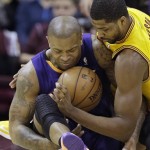 Phoenix Suns' P.J. Tucker, left, and Cleveland Cavaliers' Tristan Thompson fight for control of the ball in the first quarter of an NBA basketball game Sunday, Jan. 26, 2014, in Cleveland. (AP Photo/Mark Duncan)