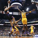 Phoenix Suns' Goran Dragic, left, of Slovenia, gets a shot off over Los Angeles Lakers' Antawn Jamison (4) in the second half of an NBA basketball game on Monday, March 18, 2013, in Phoenix. The Suns defeated the Lakers 99-76. (AP Photo/Ross D. Franklin)