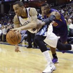 Phoenix Suns guard Leandro Barbosa, right, of Brazil, reaches in to attempt the steal against Memphis Grizzlies guard Courtney Lee in the second half of an NBA basketball game, Friday, Jan. 10, 2014, in Memphis, Tenn. The Grizzlies won 104-99. (AP Photo/Lance Murphey)